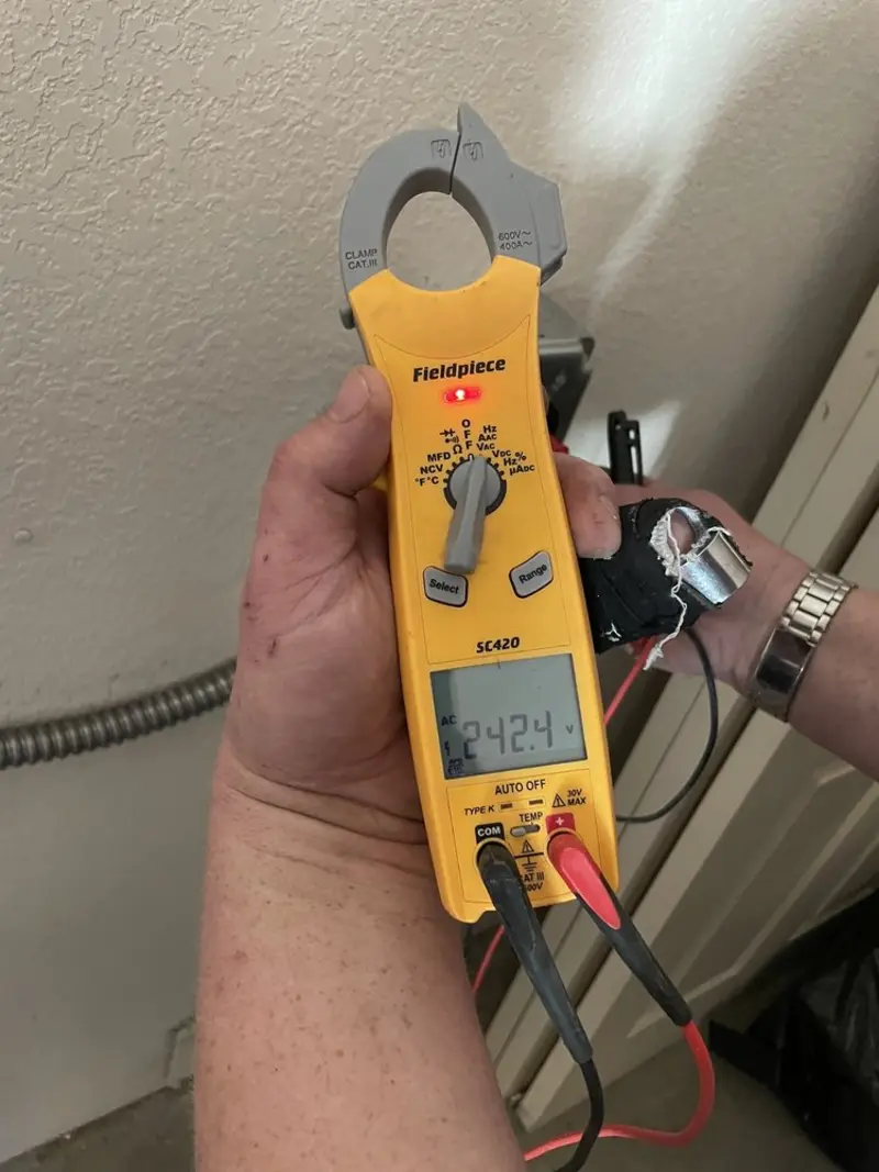 Voltage testing with clamp meter during Electrical Installation Services in Glenwood